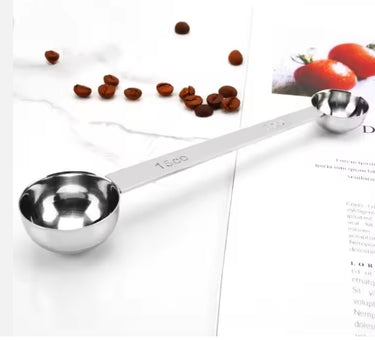 Professional double-sided stainless steel coffee scoop with 5mL and 15mL ends for accurate dosing.